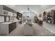 Bright bonus room with custom built-ins, craft space and comfortable seating area at 2018 Mantle Ridge Dr, Indian Trail, NC 28079
