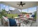 Relaxing screened-in patio with comfortable seating, perfect for enjoying the outdoors at 2018 Mantle Ridge Dr, Indian Trail, NC 28079
