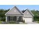 Charming single-Gathering home featuring a stone-accented facade, welcoming porch, and well-manicured landscaping at 2018 Mantle Ridge Dr, Indian Trail, NC 28079
