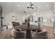 Bright, open-concept living room with a modern kitchen, fireplace, and stylish furnishings at 2018 Mantle Ridge Dr, Indian Trail, NC 28079