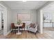 Cozy dining nook features a round table and seating for three, with a modern art piece at 208 Hollifield St, Gastonia, NC 28056