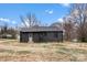 View of home's backyard with driveway at 212 Sloan St, Belmont, NC 28012