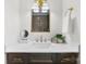 Elegant bathroom vanity with quartz countertop, dark wood cabinets, and gold fixtures at 212 Sloan St, Belmont, NC 28012