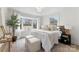 Cozy bedroom with a bay window, comfortable seating, and lots of natural light at 212 Sloan St, Belmont, NC 28012