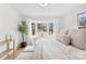 Bright bedroom featuring a bay window, comfortable seating, and lots of natural light at 212 Sloan St, Belmont, NC 28012