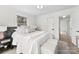Bright bedroom with a neutral color palette, comfortable bedding, and lots of natural light at 212 Sloan St, Belmont, NC 28012