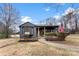 Attractive single-story home with neat landscaping, American flag, and covered porch at 212 Sloan St, Belmont, NC 28012