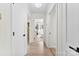 Hallway with doors leading to other rooms, natural light and hardwood floors at 212 Sloan St, Belmont, NC 28012