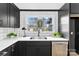Well-appointed kitchen featuring white countertops, stainless steel appliances, and ample natural light from the window at 212 Sloan St, Belmont, NC 28012