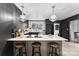 Modern kitchen featuring a large island, pendant lighting, and sleek appliances perfect for entertaining at 212 Sloan St, Belmont, NC 28012