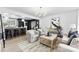 Bright and airy living room featuring modern decor, stylish furniture, and an open layout to the kitchen at 212 Sloan St, Belmont, NC 28012