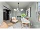 Comfortable home office featuring a stylish accent wall, white desk with gold accents, and neutral tones at 212 Sloan St, Belmont, NC 28012
