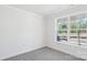 Cozy bedroom with large window and neutral color palette at 228 Miramar Dr, York, SC 29745