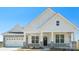 Charming home featuring a stone-accented garage and inviting front porch, blending modern and classic design at 228 Miramar Dr, York, SC 29745