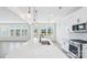 Spacious kitchen with stainless steel appliances, a large island, and lots of windows, providing ample natural light at 228 Miramar Dr, York, SC 29745