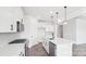 Modern kitchen featuring white cabinets, quartz countertops, stainless appliances, and a central island at 228 Miramar Dr, York, SC 29745