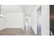 Open-concept living area with wood floors, white walls, and recessed lighting, offering a bright and airy space at 228 Miramar Dr, York, SC 29745