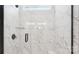 Modern shower with marble tile, glass door and bronze finish hardware at 228 Miramar Dr, York, SC 29745