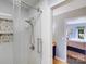 Bathroom features white tile shower with rainfall head and decorative stone niche at 2324 Chestnut Ln, Matthews, NC 28104