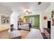 Upper level bedroom with stylish decor, accent wall, ceiling fan, and natural light at 2324 Chestnut Ln, Matthews, NC 28104