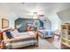 Spacious bedroom featuring dual beds, ceiling fan, accent wall, and ample natural light at 2324 Chestnut Ln, Matthews, NC 28104