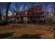 Charming Tudor-style home with brick accents and a well-manicured front yard at 2324 Chestnut Ln, Matthews, NC 28104