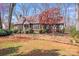 Charming Tudor-style home with brick accents and a well-manicured front yard at 2324 Chestnut Ln, Matthews, NC 28104
