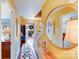 Inviting hallway featuring hardwood floors, a decorative mirror, and views to the front door and other rooms at 2324 Chestnut Ln, Matthews, NC 28104