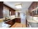 Functional kitchen with stainless steel appliances, granite counters, tile floors, and ample cabinet space for storage at 2324 Chestnut Ln, Matthews, NC 28104