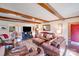 Bright living room with exposed wood beams, fireplace, and stylish decor at 2324 Chestnut Ln, Matthews, NC 28104