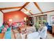 Spacious living room with vaulted ceiling, exposed beams, a cozy seating area, and lots of natural light at 2324 Chestnut Ln, Matthews, NC 28104