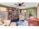 Inviting living room featuring a built-in bar, comfortable seating, and plenty of natural light at 2324 Chestnut Ln, Matthews, NC 28104