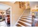Charming stairway with uplifting quotes and a view into the living room with a fireplace at 2324 Chestnut Ln, Matthews, NC 28104