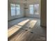 Bright living room with natural light, chandelier and large windows at 2358 Fay Jones Rd, Denver, NC 28037