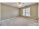 Neutral bedroom featuring a window with blinds and plush carpeting at 2955 Eppington South Dr, Fort Mill, SC 29708