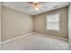 Neutral bedroom featuring a window with blinds and plush carpeting at 2955 Eppington South Dr, Fort Mill, SC 29708