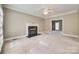 Bright living room featuring a fireplace, neutral paint, and a ceiling fan at 2955 Eppington South Dr, Fort Mill, SC 29708