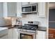 Modern kitchen featuring stainless steel appliances and subway tile backsplash at 3842 Saxonbury Way, Charlotte, NC 28269