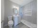Bathroom with vanity, walk-in shower, and black and white tile floors at 410 E Arch St, Lancaster, SC 29720