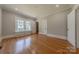 Neutral bedroom featuring hardwood floors, window seat, and access to a closet at 410 E Arch St, Lancaster, SC 29720
