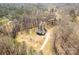 A charming home surrounded by a forest, featuring an outbuilding and a long private drive at 4604 Karwood Dr, Rock Hill, SC 29732