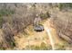 A secluded, wooded property with a home and outbuilding, accessed by a private driveway at 4604 Karwood Dr, Rock Hill, SC 29732