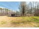 Expansive backyard featuring a screened porch, shed, and additional storage building at 4604 Karwood Dr, Rock Hill, SC 29732