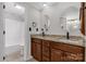 Bathroom featuring a double vanity, granite countertops, and a shower tub at 4604 Karwood Dr, Rock Hill, SC 29732