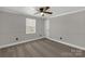 Cozy bedroom with a window and paneled walls, offering a comfortable retreat at 4604 Karwood Dr, Rock Hill, SC 29732