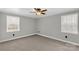 Bright bedroom with neutral carpet, paneled walls, and a window at 4604 Karwood Dr, Rock Hill, SC 29732