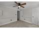 Bedroom featuring neutral carpet, ceiling fan, and paneled walls at 4604 Karwood Dr, Rock Hill, SC 29732