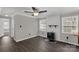 Comfortable living room with wood-look flooring, wood burning fireplace, and bright windows at 4604 Karwood Dr, Rock Hill, SC 29732