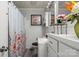 Cozy bathroom with floral shower curtain, gray walls, and white tile at 468 Wilhelm Ne Pl, Concord, NC 28025