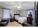 Bedroom with neutral walls, ambient light from windows, and cozy carpeting at 468 Wilhelm Ne Pl, Concord, NC 28025